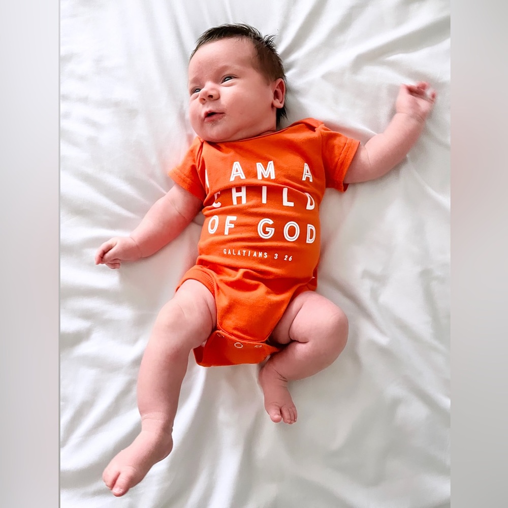 Onesie Christian Bible verse “I am a child of God” orange 🍊